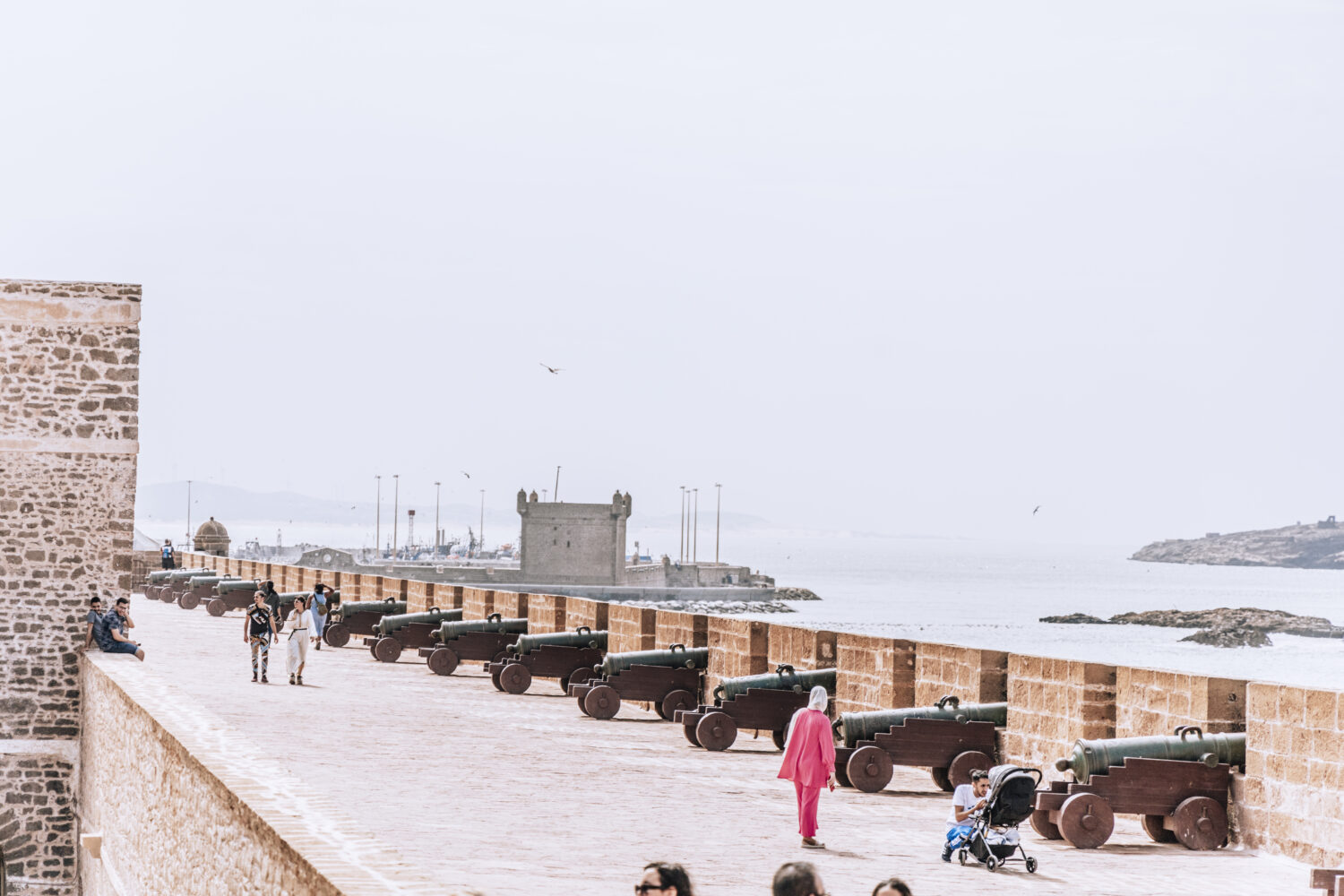 Walking along the coast of Essaouira during 15 Days Morocco Tour From Casablanca